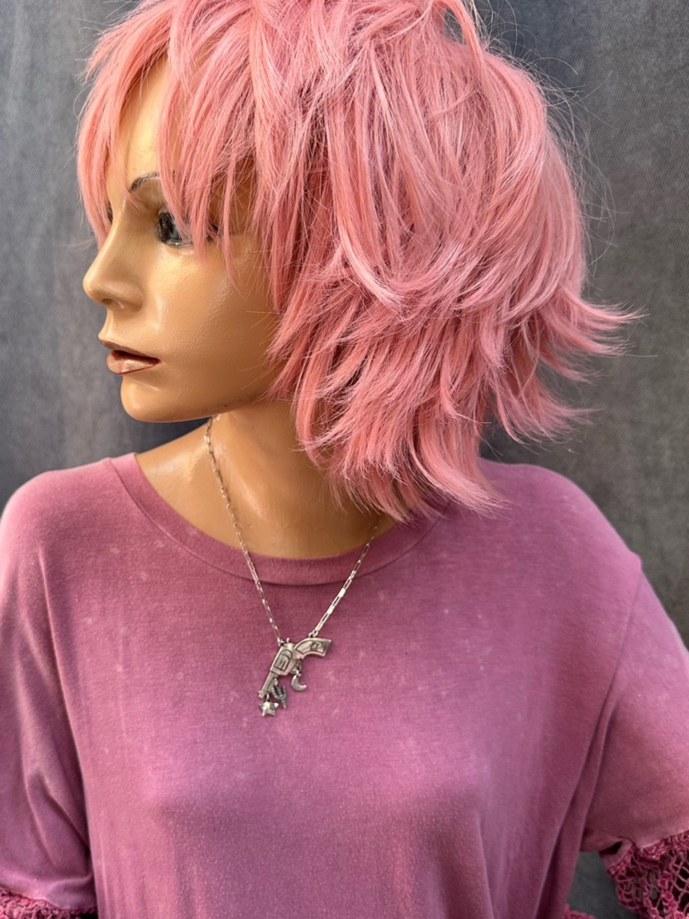Silver revolver necklace